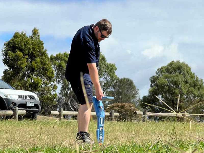 Man using underground detection device