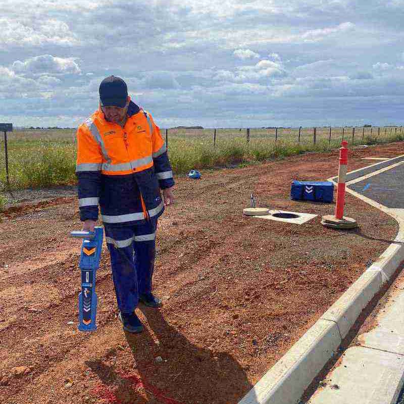 Man using underground detection device